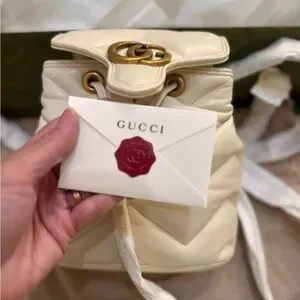 Gucci | Bags | Gucci Ivory Backpack With Gold Accent | Poshmark display picture 1